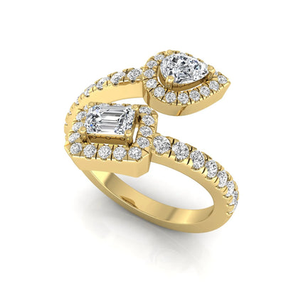 yellow gold Open bypass lab grown diamond wrap ring featuring pear cut and emerald cut diamonds surrounded by halo accents with a pavé diamond band.
