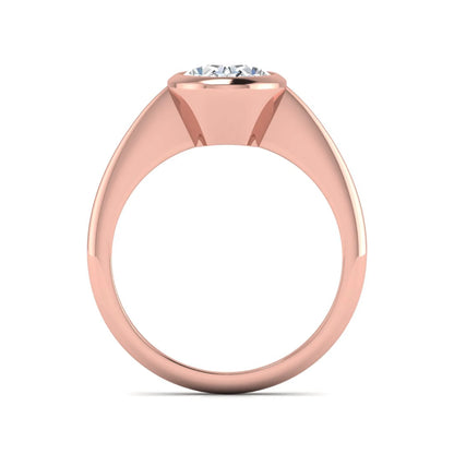 Oval cut lab grown diamond solitaire engagement ring in a bezel setting with a rose gold tone minimalist band.