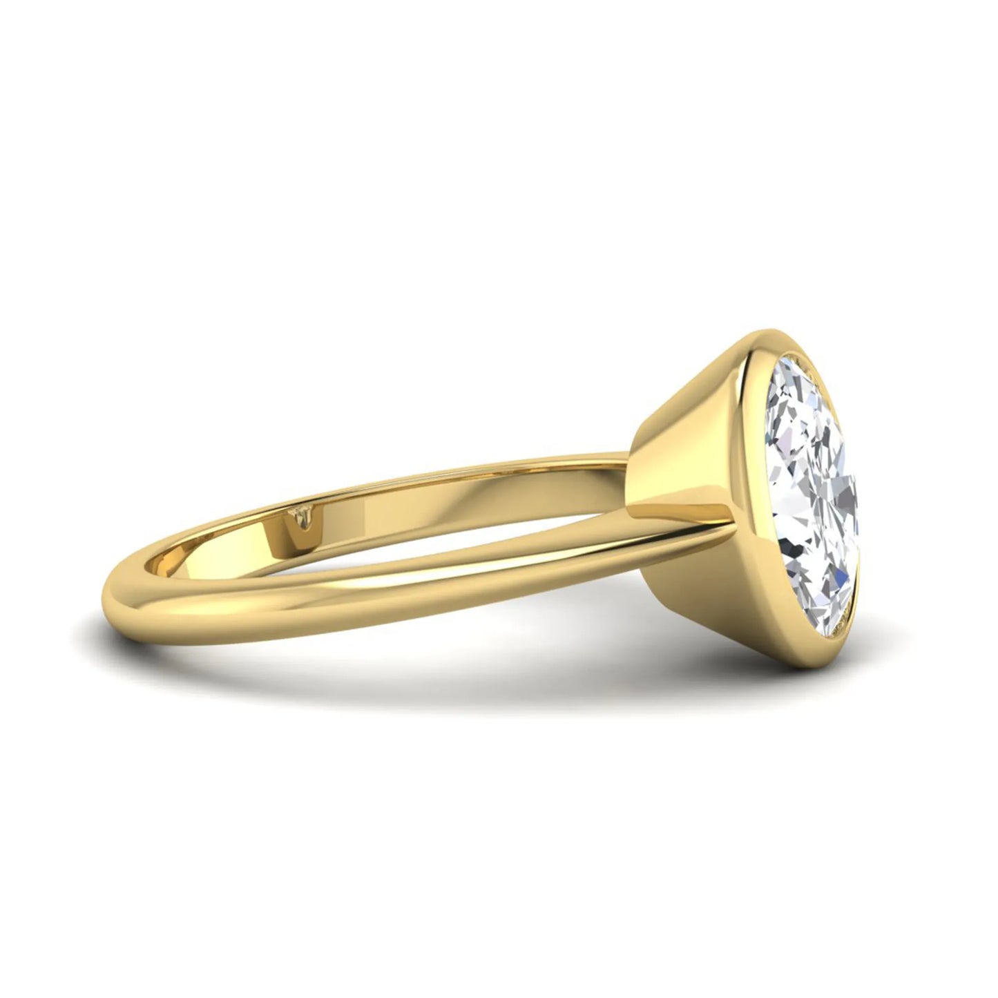 Oval cut lab grown diamond solitaire engagement ring in a bezel setting with a yellow gold tone minimalist band.