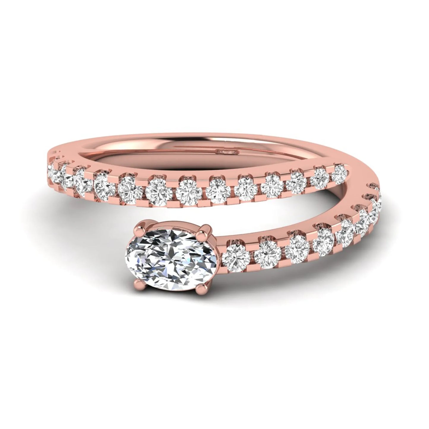 Oval cut lab grown diamond bypass engagement ring with round pavé accent diamonds in a four-prong setting in rose gold