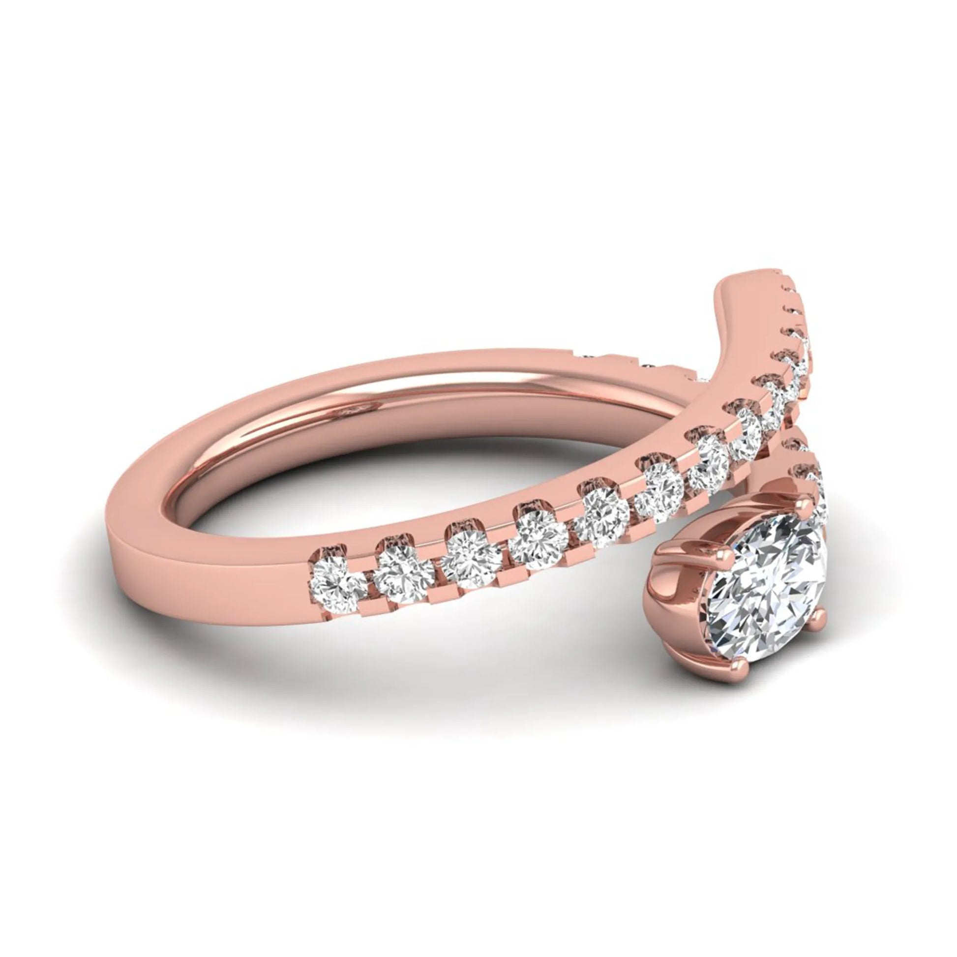Oval cut lab grown diamond bypass engagement ring with round pavé accent diamonds in a four-prong setting in rose gold