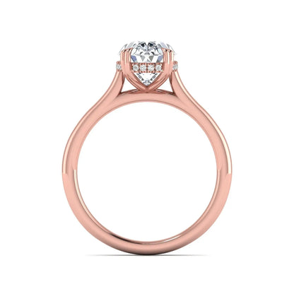 Oval cut hidden halo lab grown diamond engagement ring with double claw prongs in rose gold.