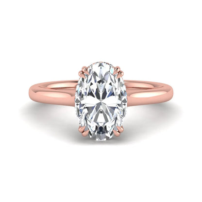 Oval cut hidden halo lab grown diamond engagement ring with double claw prongs in rose gold.