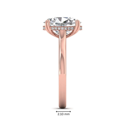 Oval cut hidden halo lab grown diamond engagement ring with double claw prongs in rose gold.