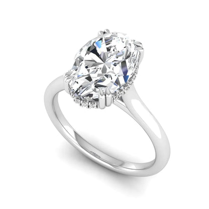 Oval cut hidden halo lab grown diamond engagement ring with double claw prongs in white gold.