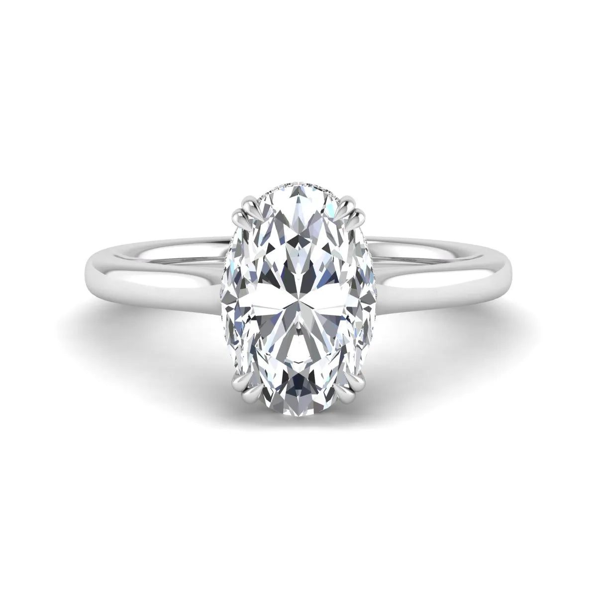 Oval cut hidden halo lab grown diamond engagement ring with double claw prongs in white gold.