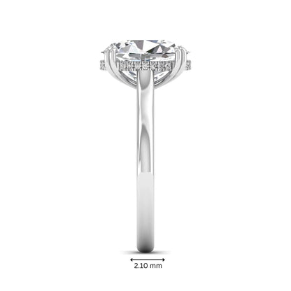 Oval cut hidden halo lab grown diamond engagement ring with double claw prongs in white gold.