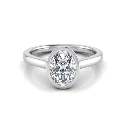 Oval cut lab grown diamond bezel solitaire engagement ring featuring a 0.75 carat center diamond in polished white gold.