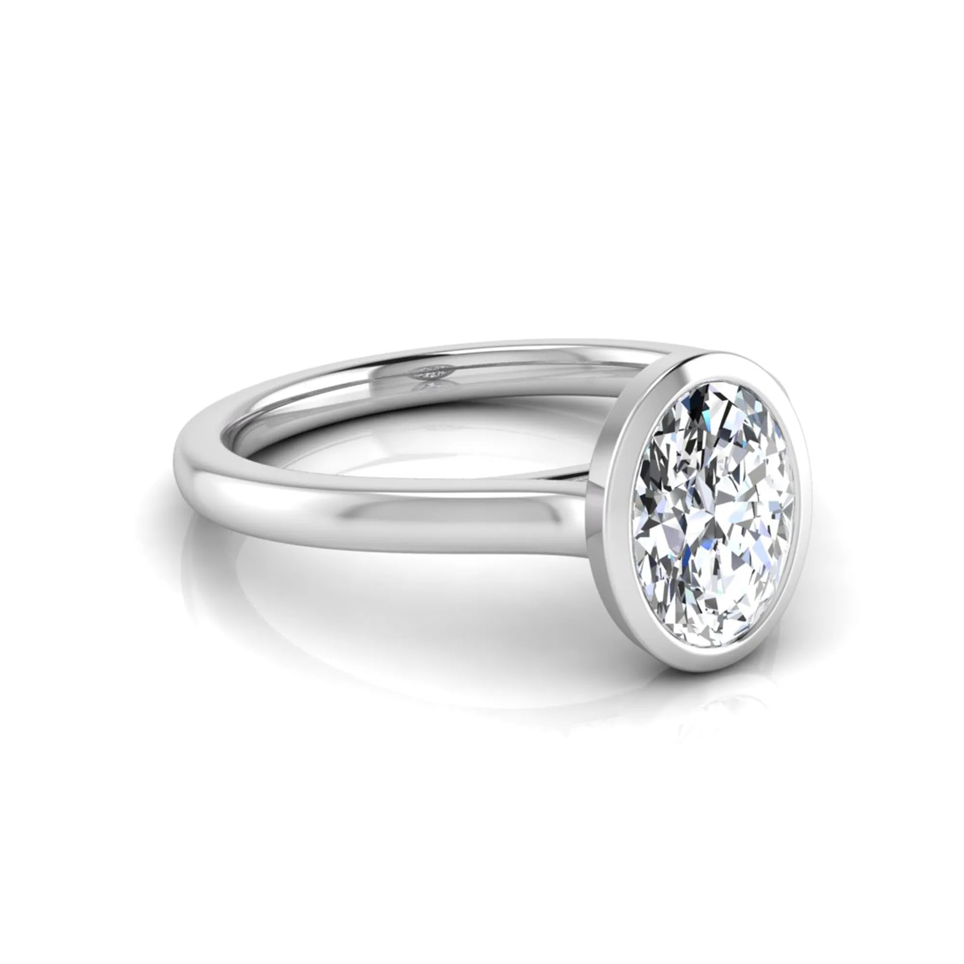 Oval cut lab grown diamond bezel solitaire engagement ring featuring a 0.75 carat center diamond in polished white gold.