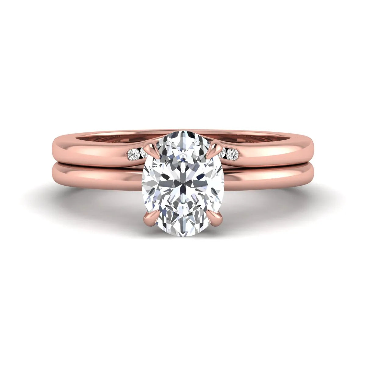IGI certified oval cut lab grown diamond bridal ring set featuring a hidden halo engagement ring with a matching curved diamond wedding band in rose gold.