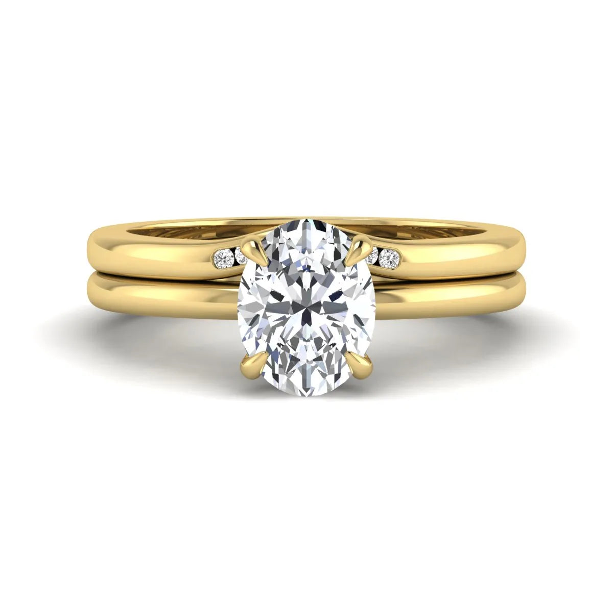 IGI certified oval cut lab grown diamond bridal ring set featuring a hidden halo engagement ring with a matching curved diamond wedding band in yellow gold.
