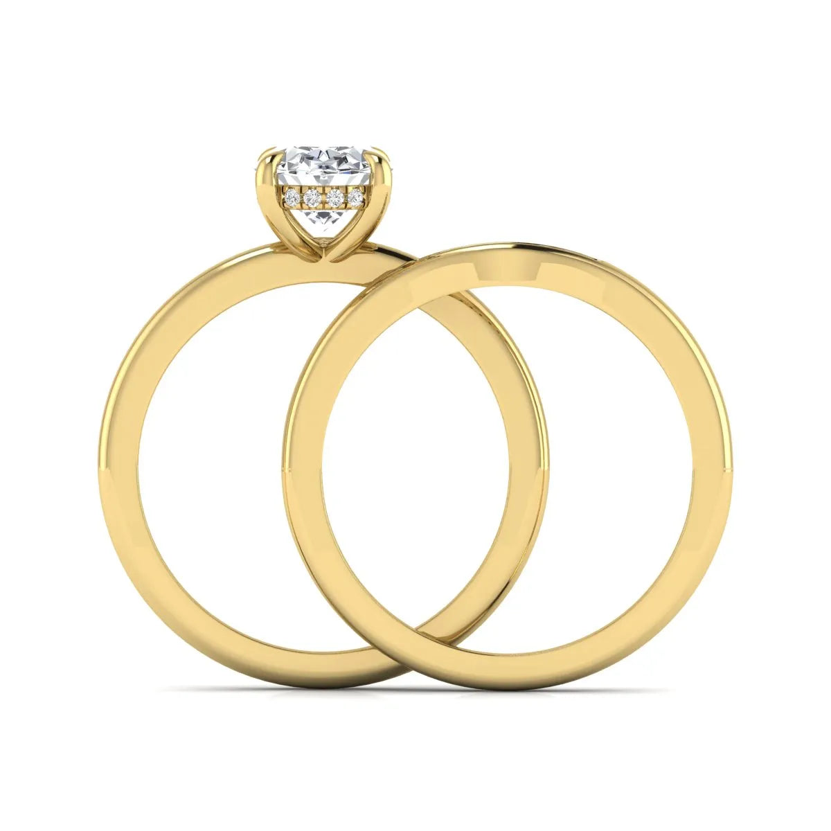 IGI certified oval cut lab grown diamond bridal ring set featuring a hidden halo engagement ring with a matching curved diamond wedding band in yellow gold.
