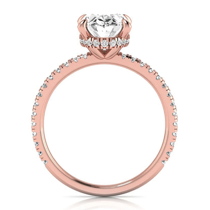 Oval cut lab grown diamond engagement ring featuring a 2.30 carat IGI certified center diamond with hidden halo and pavé round side diamonds in rose gold.
