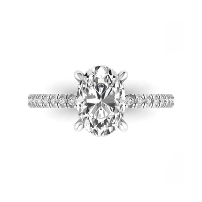 Oval cut lab grown diamond engagement ring featuring a 2.30 carat IGI certified center diamond with hidden halo and pavé round side diamonds in white gold.
