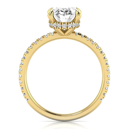 Oval cut lab grown diamond engagement ring featuring a 2.30 carat IGI certified center diamond with hidden halo and pavé round side diamonds in yellow gold.