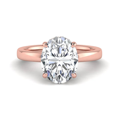 IGI certified oval cut lab grown diamond hidden halo solitaire engagement ring in rose gold.
