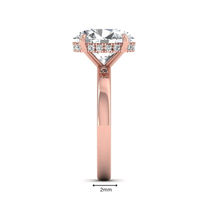 IGI certified oval cut lab grown diamond hidden halo solitaire engagement ring in rose gold.