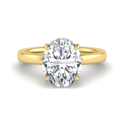 IGI certified oval cut lab grown diamond hidden halo solitaire engagement ring in yellow gold.