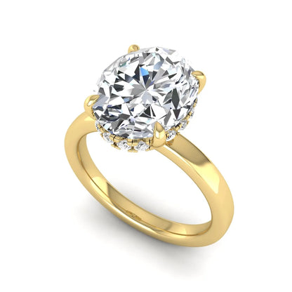 IGI certified oval cut lab grown diamond hidden halo solitaire engagement ring in yellow gold.