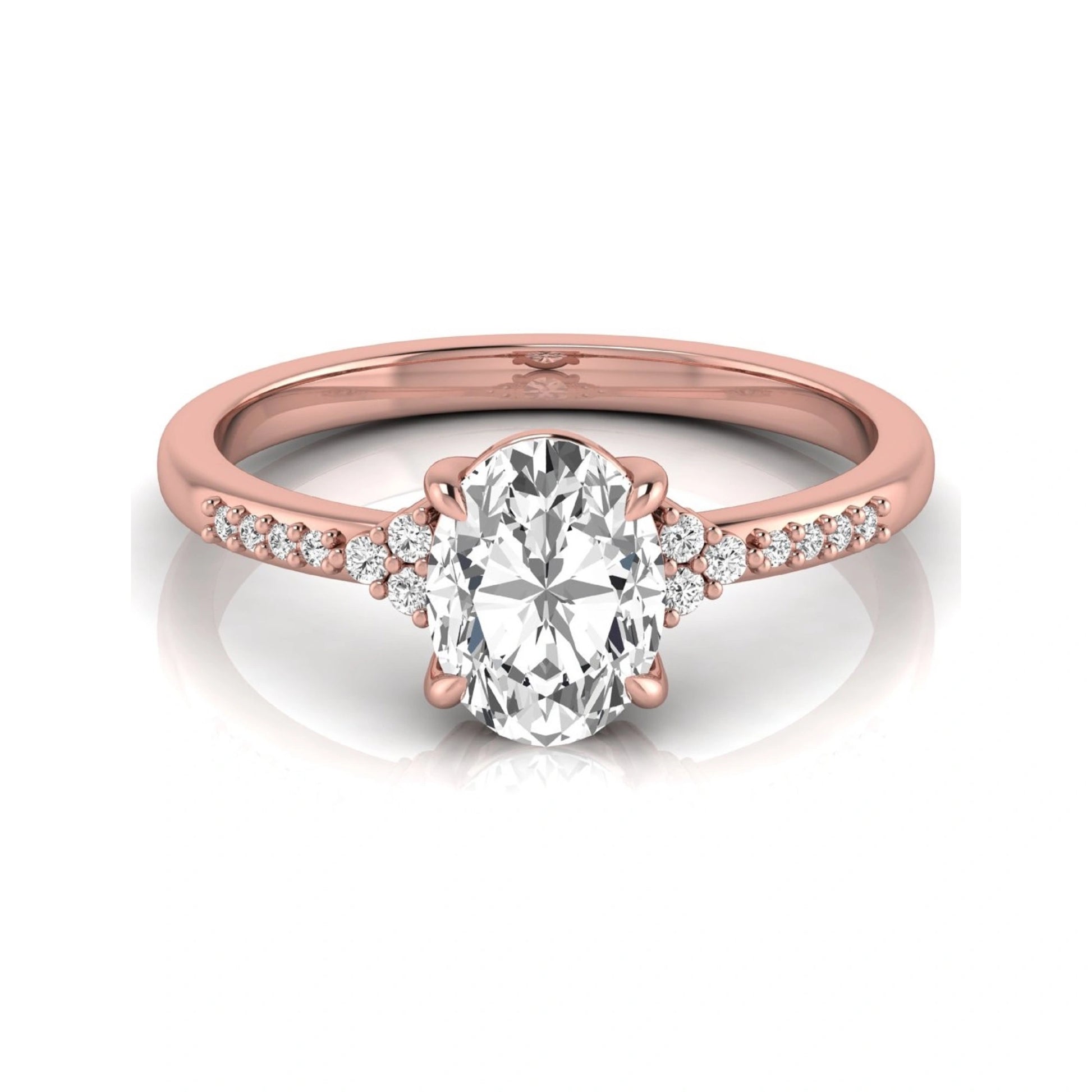 Oval cut lab grown diamond side stone engagement ring featuring a 1.40 carat IGI certified center diamond with round accent diamonds in rose gold.