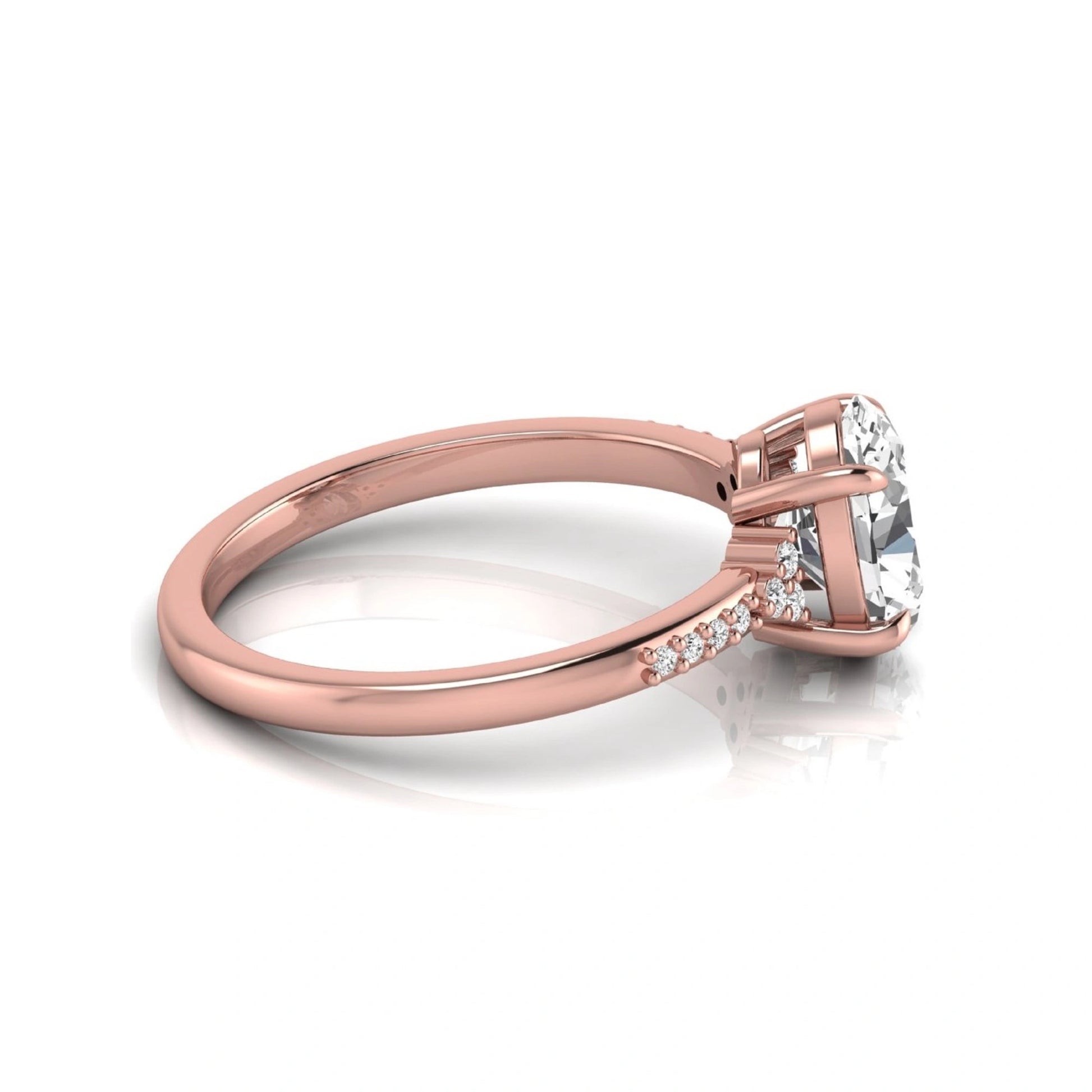 Oval cut lab grown diamond side stone engagement ring featuring a 1.40 carat IGI certified center diamond with round accent diamonds in rose gold.