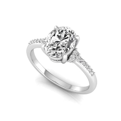 Oval cut lab grown diamond side stone engagement ring featuring a 1.40 carat IGI certified center diamond with round accent diamonds in white gold.