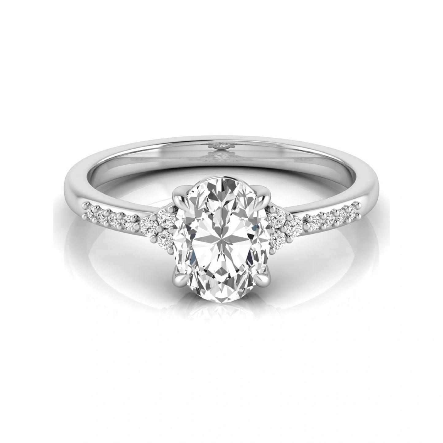 Oval cut lab grown diamond side stone engagement ring featuring a 1.40 carat IGI certified center diamond with round accent diamonds in white gold.