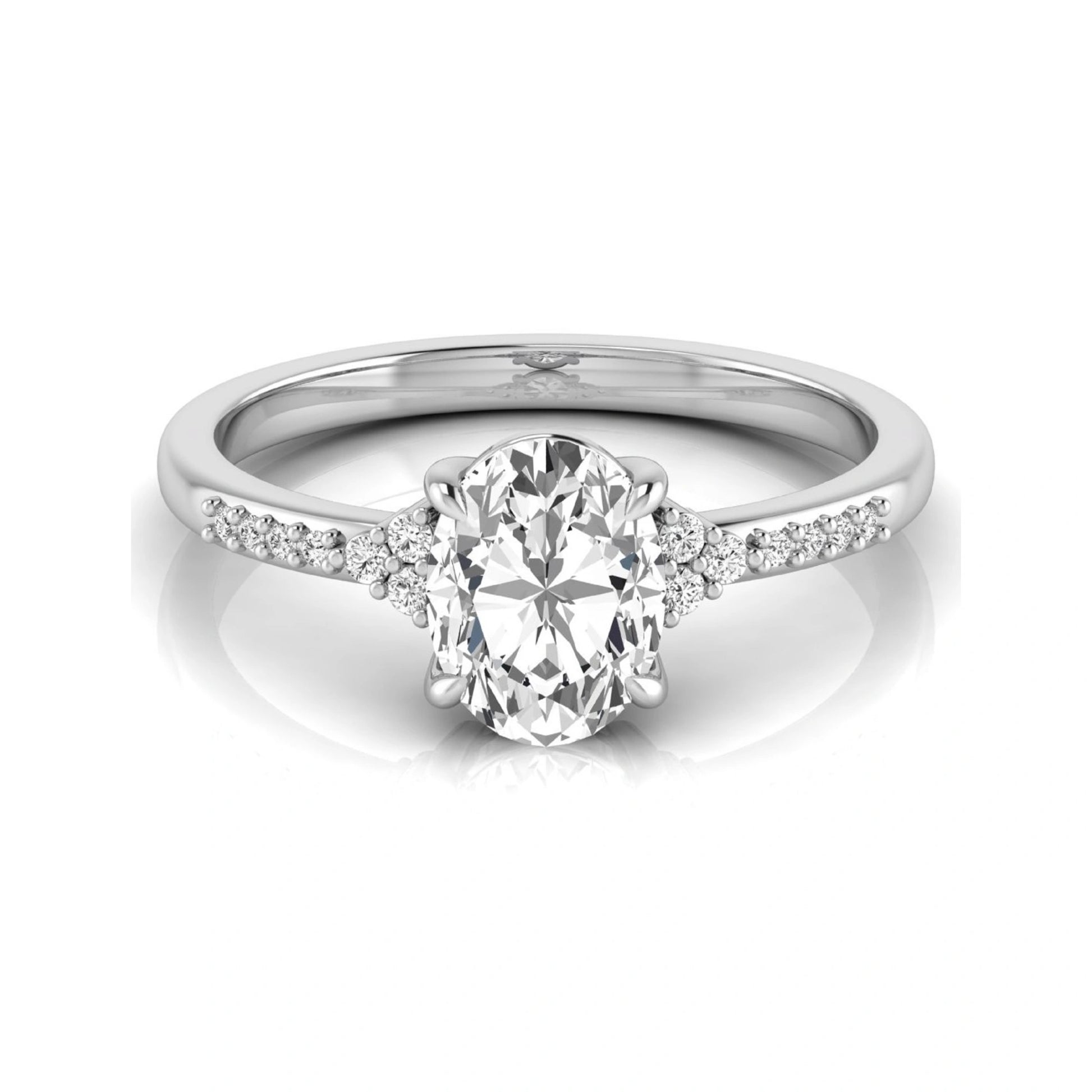 Oval cut lab grown diamond side stone engagement ring featuring a 1.40 carat IGI certified center diamond with round accent diamonds in white gold.