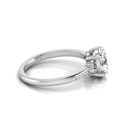 Oval cut lab grown diamond side stone engagement ring featuring a 1.40 carat IGI certified center diamond with round accent diamonds in white gold.