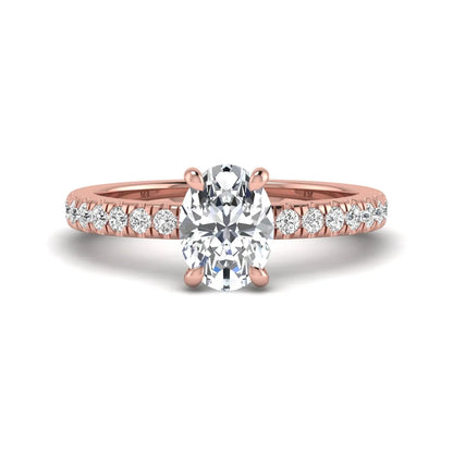 IGI certified oval cut lab grown diamond solitaire accent engagement ring with pavé round diamond band in rose gold.