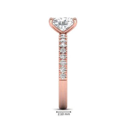 IGI certified oval cut lab grown diamond solitaire accent engagement ring with pavé round diamond band in rose gold.