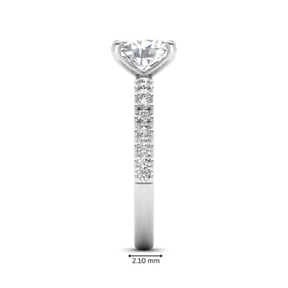 IGI certified oval cut lab grown diamond solitaire accent engagement ring with pavé round diamond band in white gold.