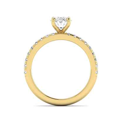 IGI certified oval cut lab grown diamond solitaire accent engagement ring with pavé round diamond band in yellow gold.