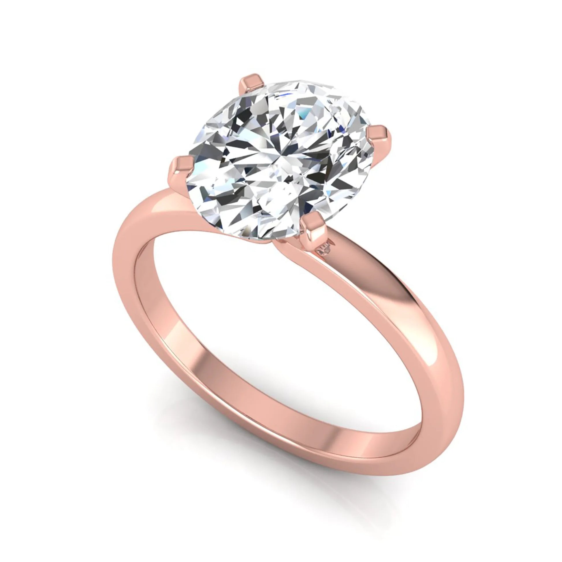 Oval cut lab grown diamond solitaire engagement ring featuring a four-prong setting with a rose gold tone band.