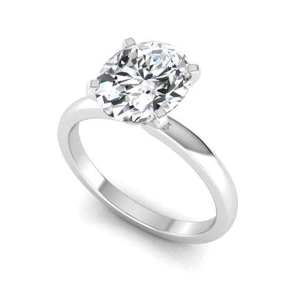 Oval cut lab grown diamond solitaire engagement ring featuring a four-prong setting with a white gold tone band.