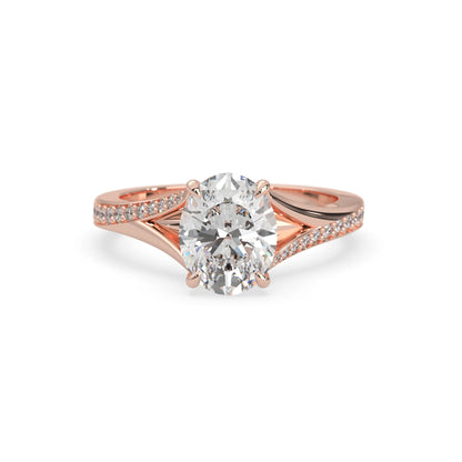 Oval cut lab grown diamond split shank engagement ring with diamond accented band in rose gold