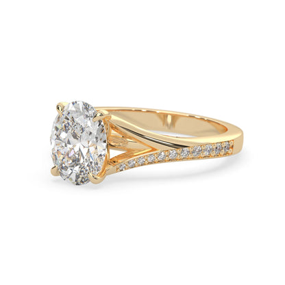 Oval cut lab grown diamond split shank engagement ring with diamond accented band in yellow gold