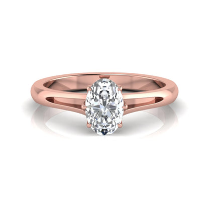 Oval cut lab grown diamond solitaire engagement ring featuring a four-prong setting and elegant split shank band in rose gold tone.