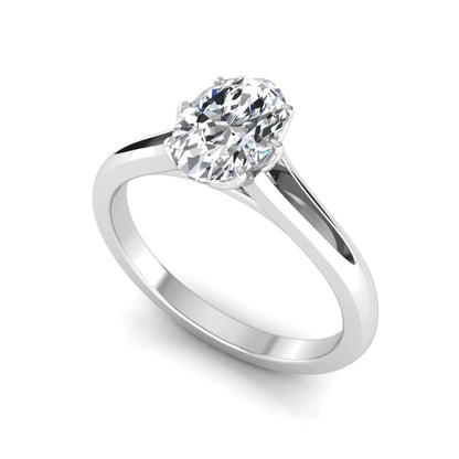 Oval cut lab grown diamond solitaire engagement ring featuring a four-prong setting and elegant split shank band in white gold tone.