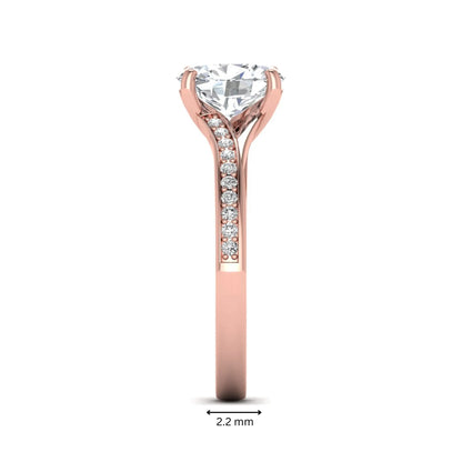 Oval cut lab grown diamond split shank pavé engagement ring with four-prong setting and rose gold tone band.