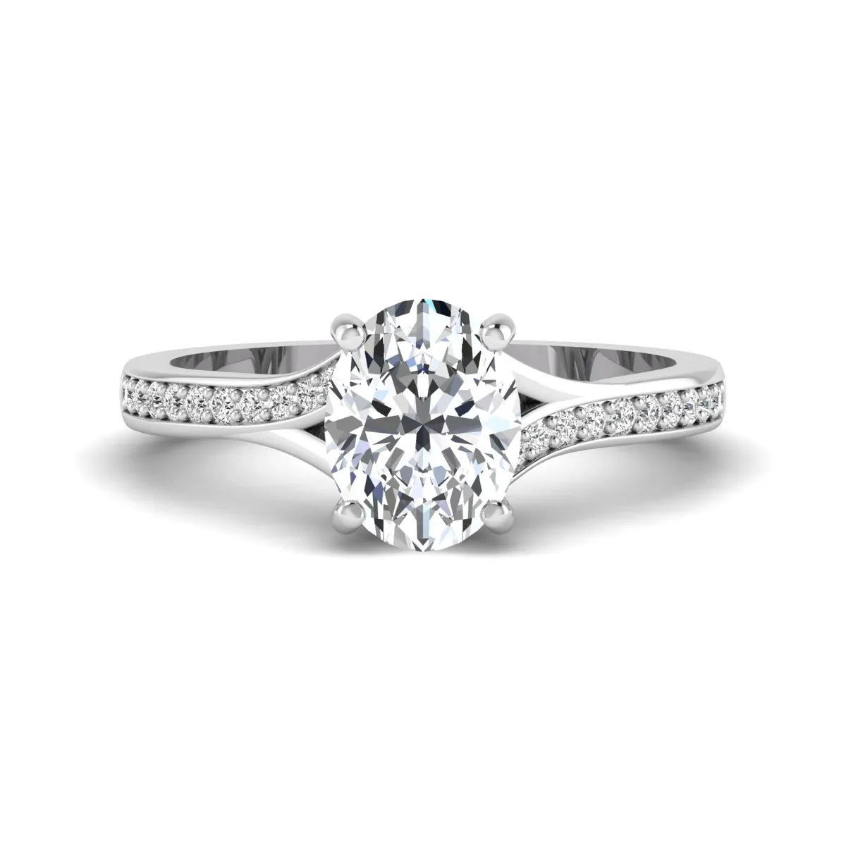 Oval cut lab grown diamond split shank pavé engagement ring with four-prong setting and white gold tone band.