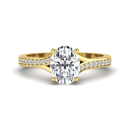 Oval cut lab grown diamond split shank pavé engagement ring with four-prong setting and yellow gold tone band.