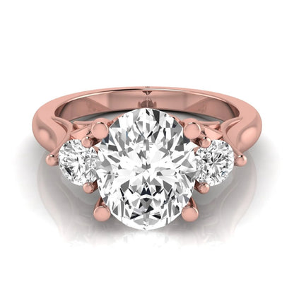 Oval cut lab grown diamond three stone engagement ring featuring a 1.86 carat IGI certified center diamond with round side diamonds in yellow gold.
