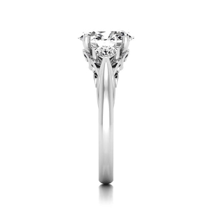 Oval cut lab grown diamond three stone engagement ring featuring a 1.86 carat IGI certified center diamond with round side diamonds in yellow gold.