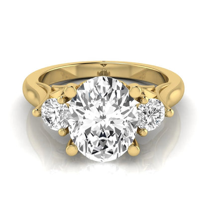 Oval cut lab grown diamond three stone engagement ring featuring a 1.86 carat IGI certified center diamond with round side diamonds in yellow gold.