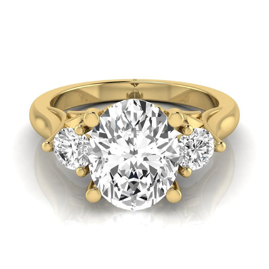 Oval cut lab grown diamond three stone engagement ring featuring a 1.86 carat IGI certified center diamond with round side diamonds in yellow gold.