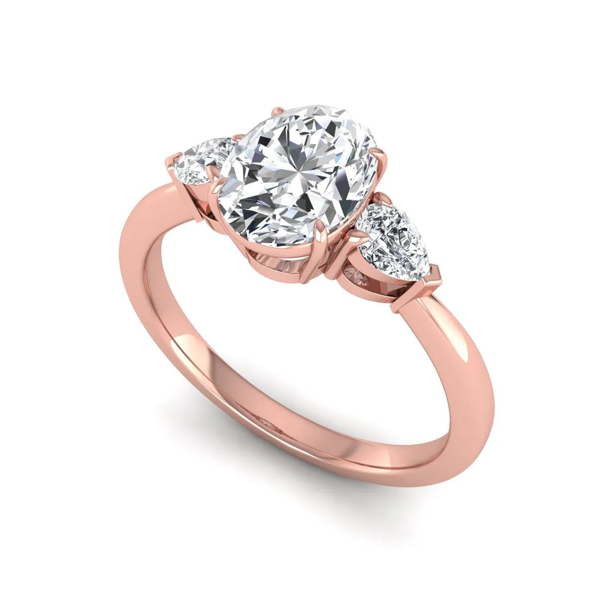Oval cut lab grown diamond three stone engagement ring with pear cut side diamonds and prong setting in rose gold tone.