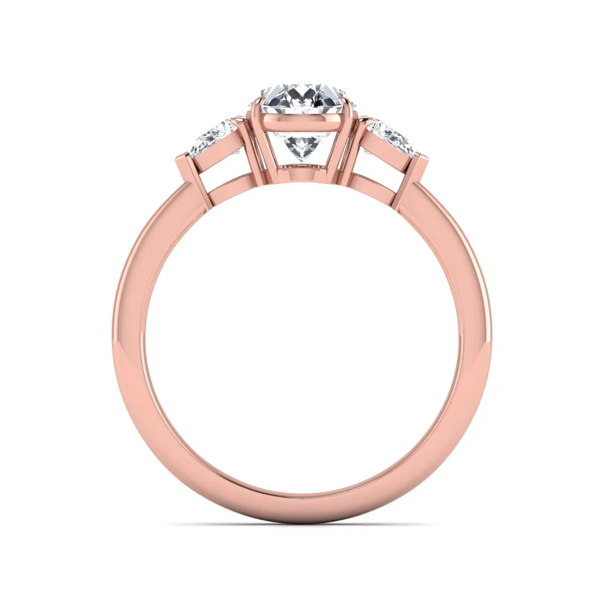 Oval cut lab grown diamond three stone engagement ring with pear cut side diamonds and prong setting in rose gold tone.