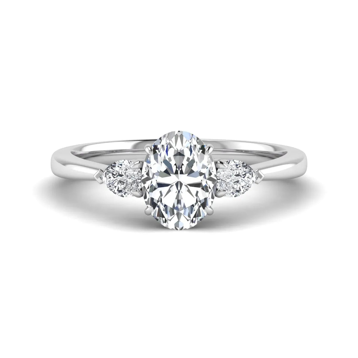 Oval cut lab grown diamond three stone engagement ring with pear cut side diamonds and prong setting in white gold tone.