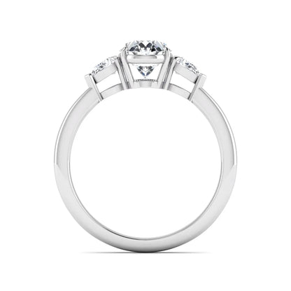 Oval cut lab grown diamond three stone engagement ring with pear cut side diamonds and prong setting in white gold tone.